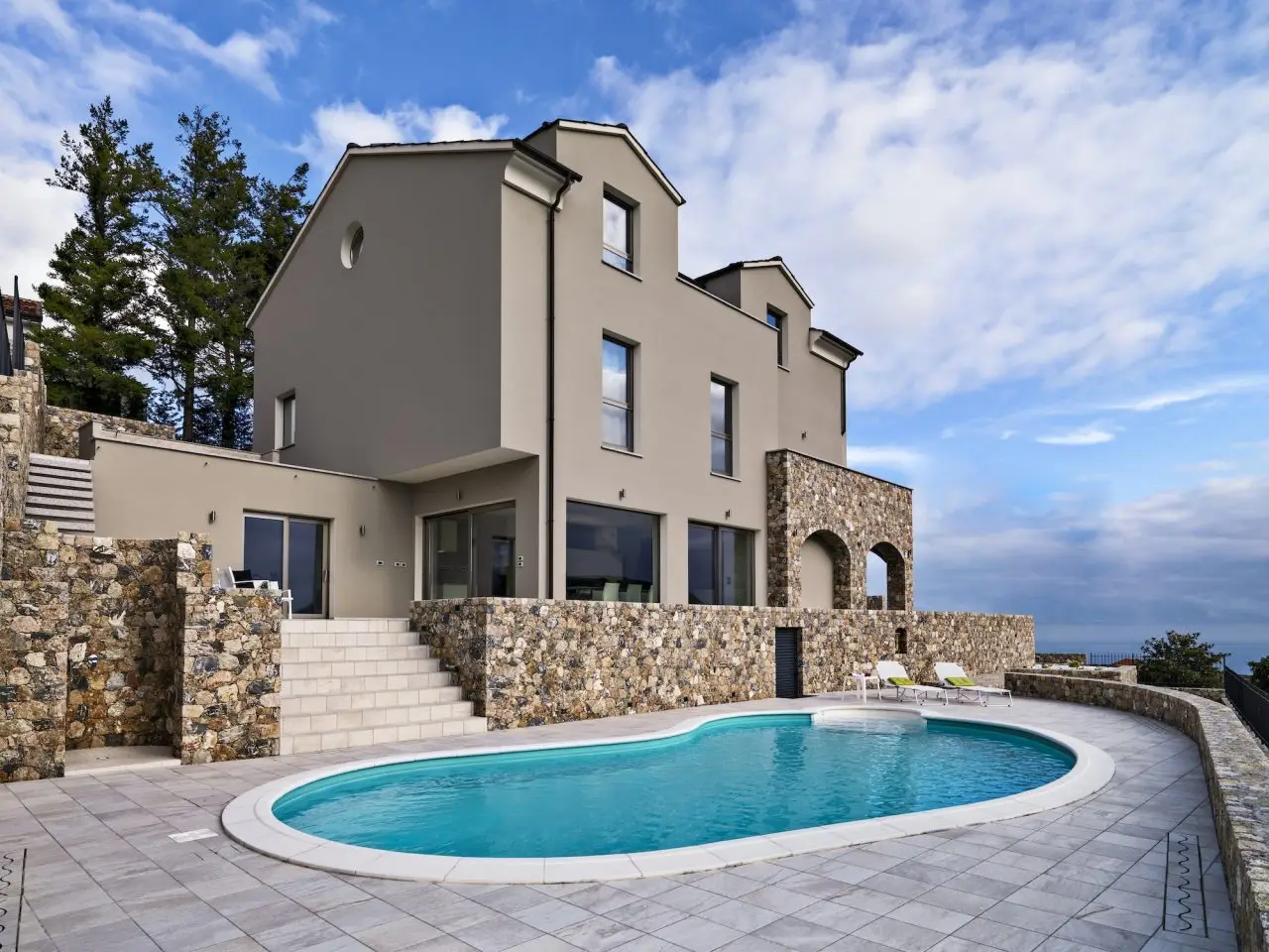Home 1 exteriors view of a modern villa in the foreground the swimming pool